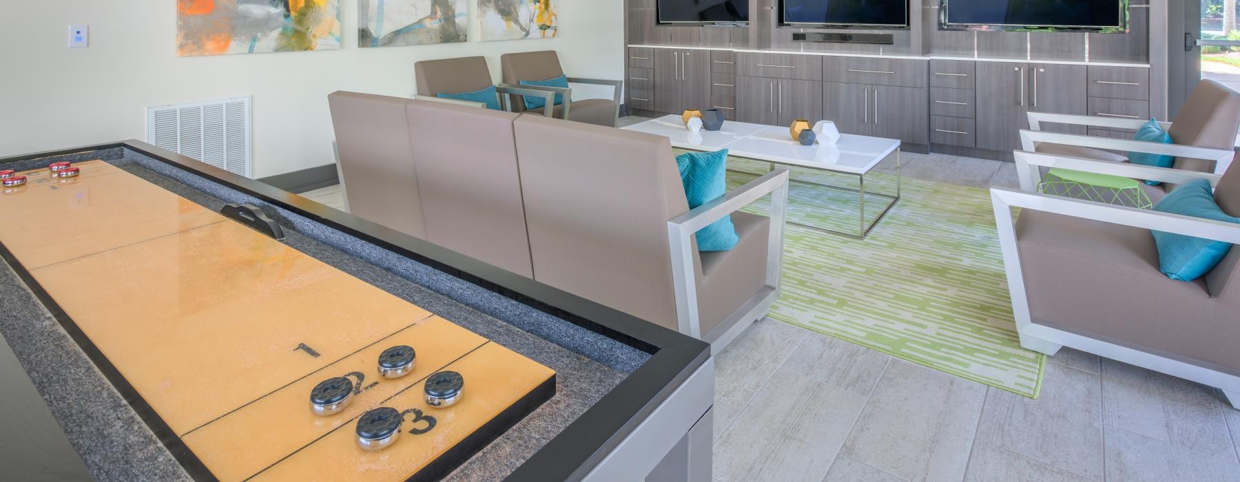 clubhouse with tvs and couches