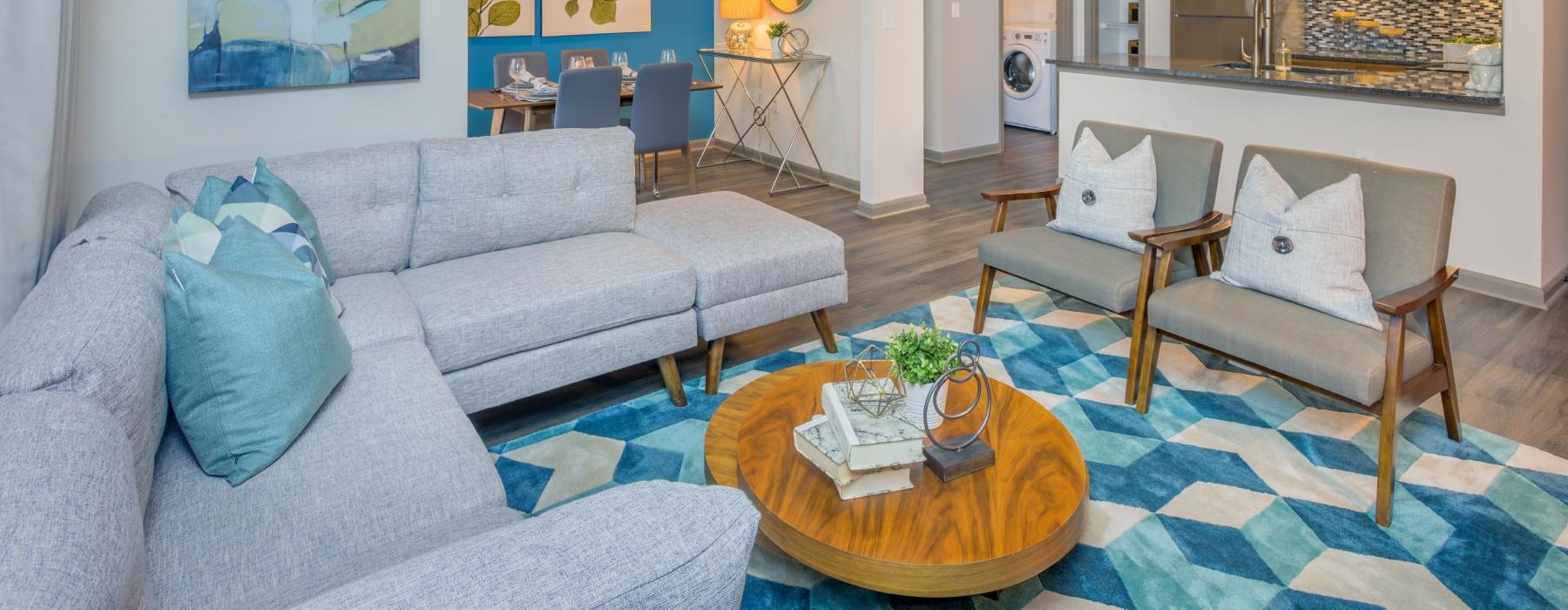 spacious living room bright and open to kitchen and dining areas